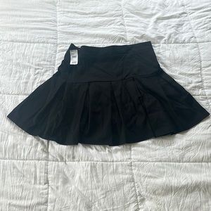 Preppy black pleated skirt from Tilly’s.